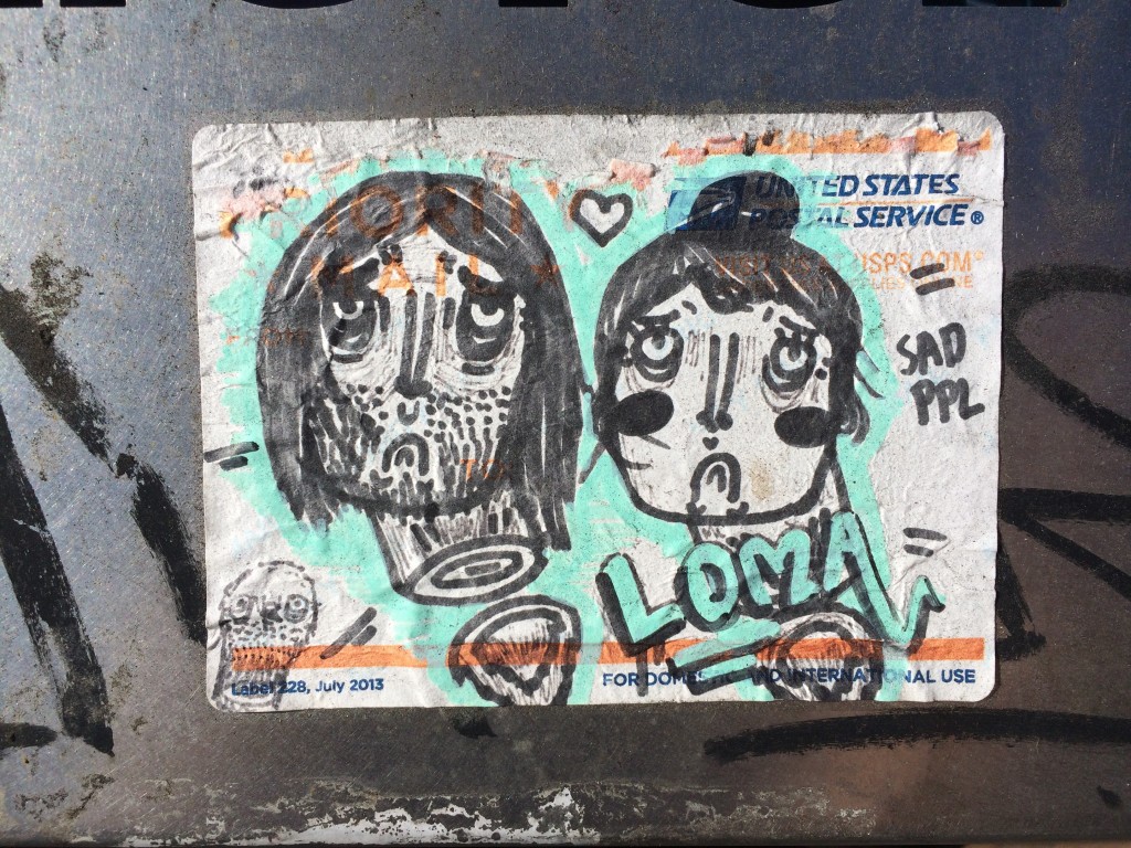 Graffiti of two sad faces