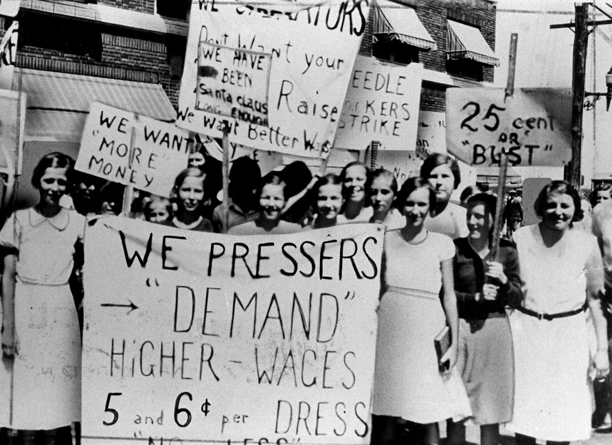 Women pressers on strike for higher wages. Best sign: "We have been Santa Claus long enough." Photo via the Kheel Center.